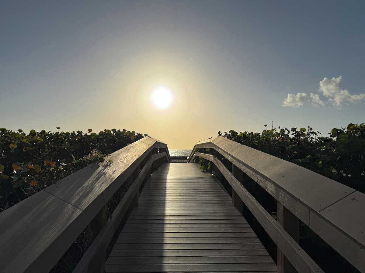 Boardwalk toward the beach in late-day light