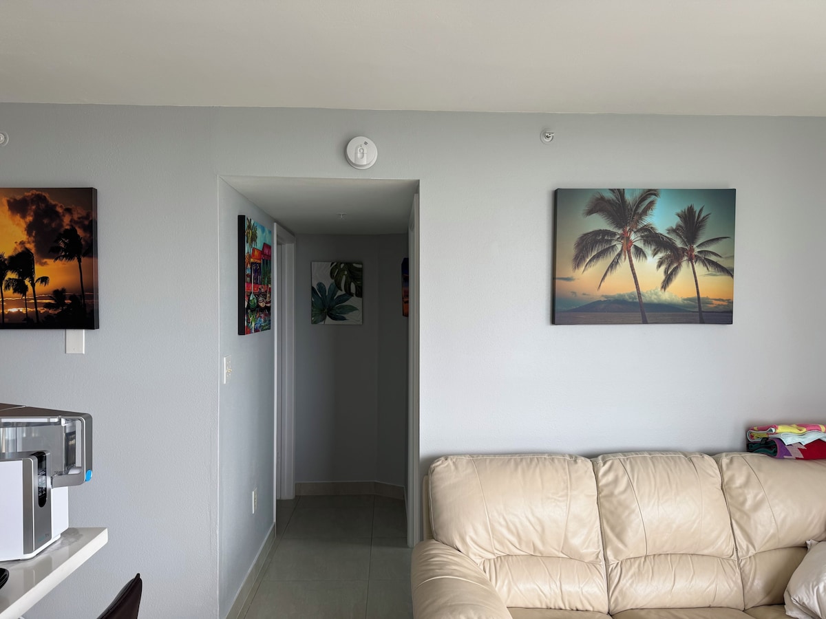 Living area with a sofa and a coffee maker